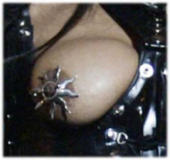 Closeup of Janet Jacksons breast and pierced nipple and star nipple ring